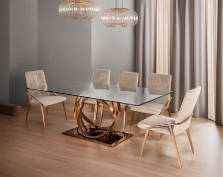 8 seater rectangular dining table with clear tempered glass top and artful stainless steel base plated in rose gold. Dining chair upholstered in fabric with rose gold plated stainless steel legs.