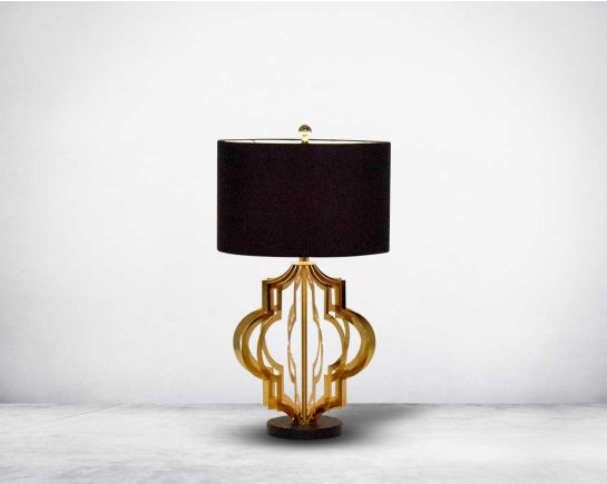 Table lamp in gold finish and marble base with a black fabric shade in ultra modern design.