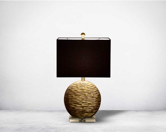 Table lamp in gold decorative glass base on a silver-plated metal stands with black fabric translucent fabric shade front view