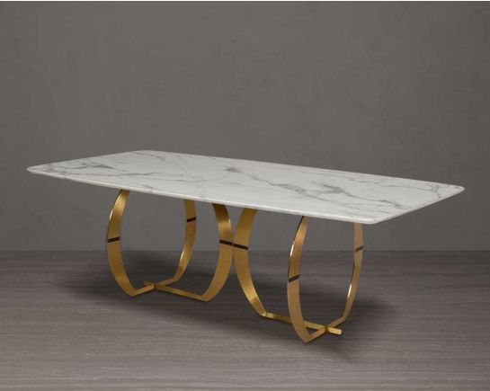 This beautiful & delicate 8-seater marble dining table is crafted to perfection. It is cast with a natural white a cursive artful base in matt gold plated stainless steel.
