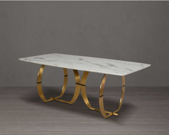 This beautiful & delicate 6-seater marble dining table is crafted to perfection. It is cast with a natural white a cursive artful base in matt gold plated stainless steel.