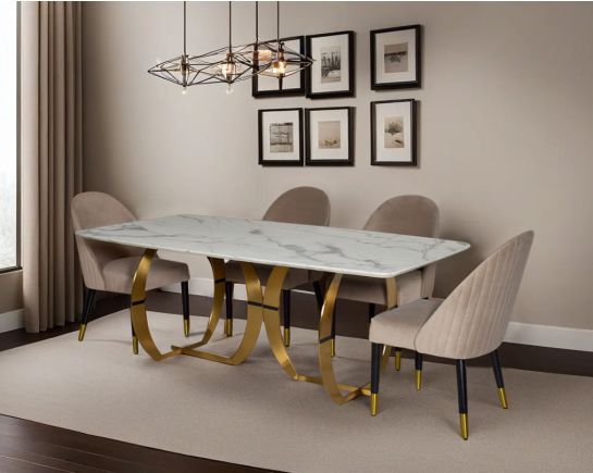 This beautiful & delicate 6 & 8 seater marble dining table is crafted to perfection. It is cast with a natural white a cursive artful base in matt gold plated stainless steel. "Minimalistically designed chair with wooden legs for enhanced durability. it i