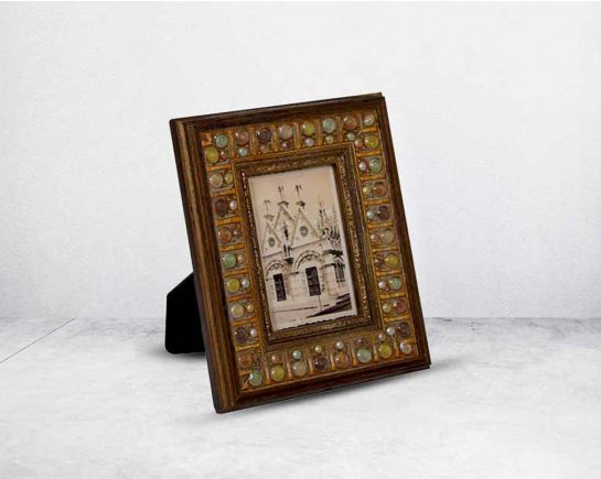 Photo frame in wood with stone embellished decorative frame in modern classic design.