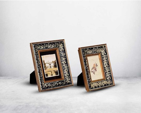 two Photo frame in wood with decorative border in classic design.