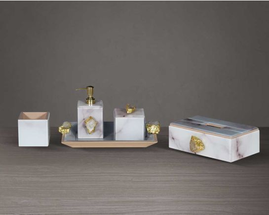 This glossy white marble design bathroom accessories set comprises a lotion dispenser/tbh/cotton jar tray & gold finished stone knob. Glass liquid dispensers and hand wash dispensers are sleek and modern, offering a more minimalist look.