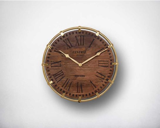 Wall clock in antique matt brass and natural wood finish in Roman numerals.