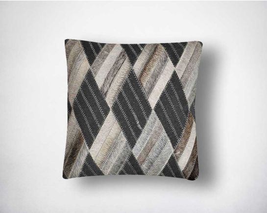 Black and grey hair on the leather cushion.