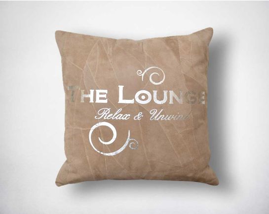 Leather cushion with silver foil print.