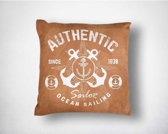 Leather cushion with white print.