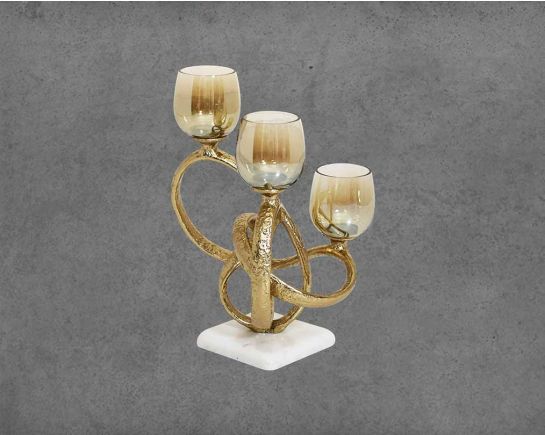 Multi T-light candle holder in gold-finished nickel plated aluminum, smoke luster glass with white marble base.