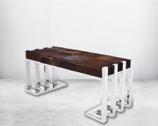 Double bench upholstered in light brown hide seat and high polished stainless steel legs in rich contemporary design.