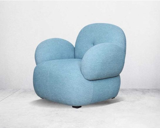 This modern chic occasional armchair upholstered in high-quality boucle fabric with a curvy design mingles perfectly with an elegant setting which adds spunk to any space.